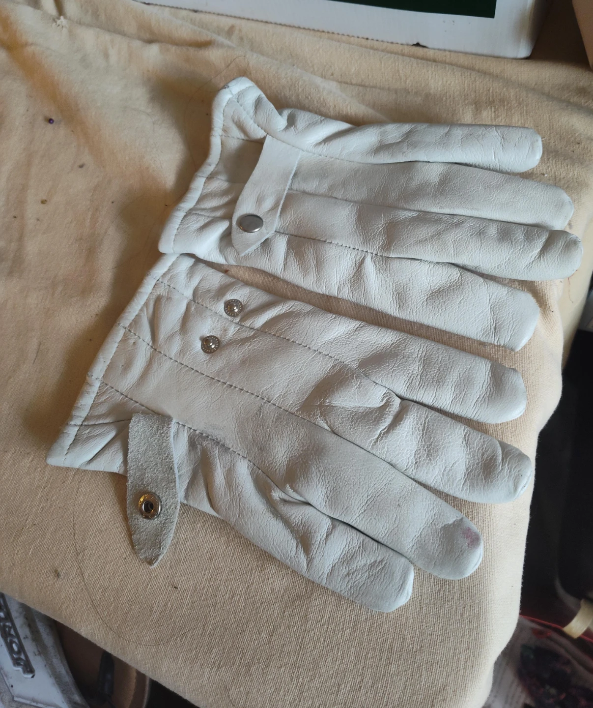 White leather gloves