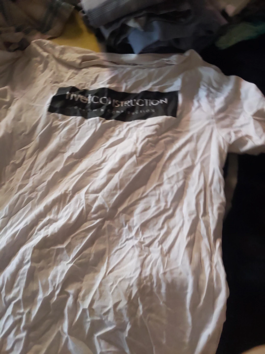 White t-shirt with "Five J Construction" logo