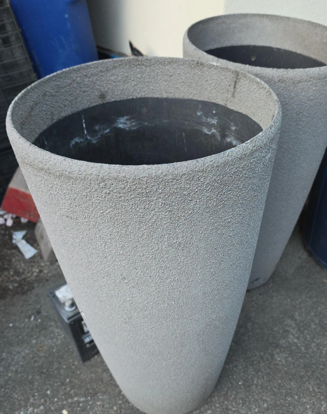 Two tall textured grey planters