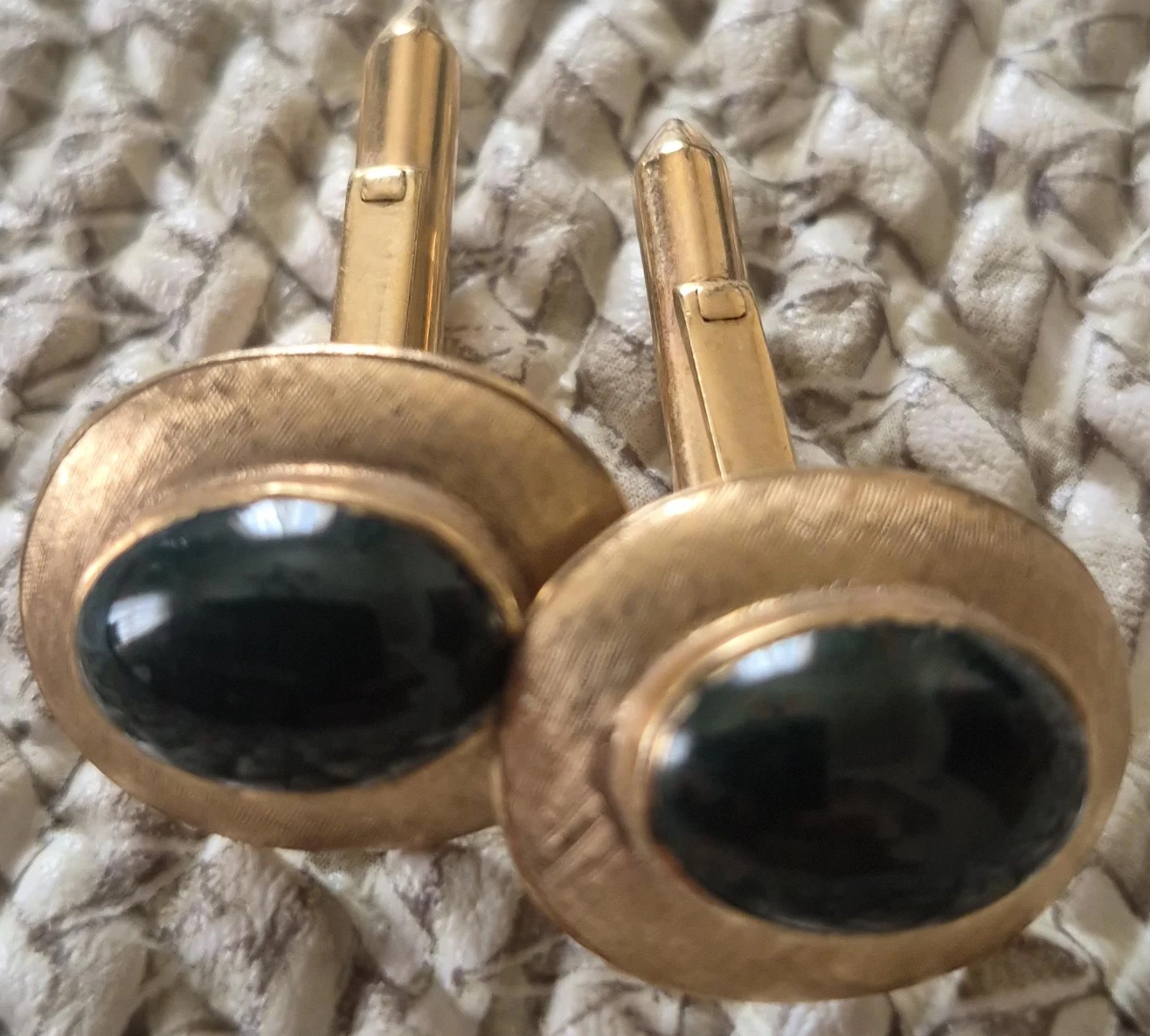 Gold-tone cufflinks with black oval stone