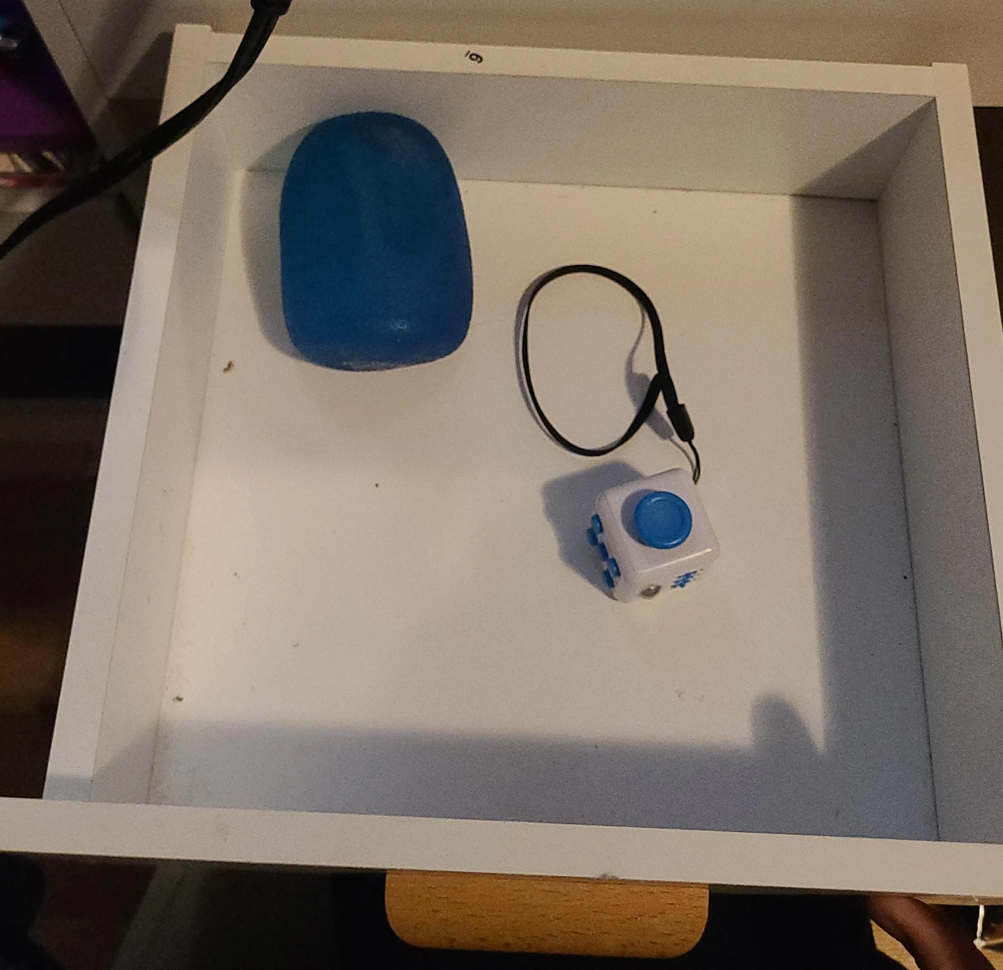 Fidget toy and blue stress ball