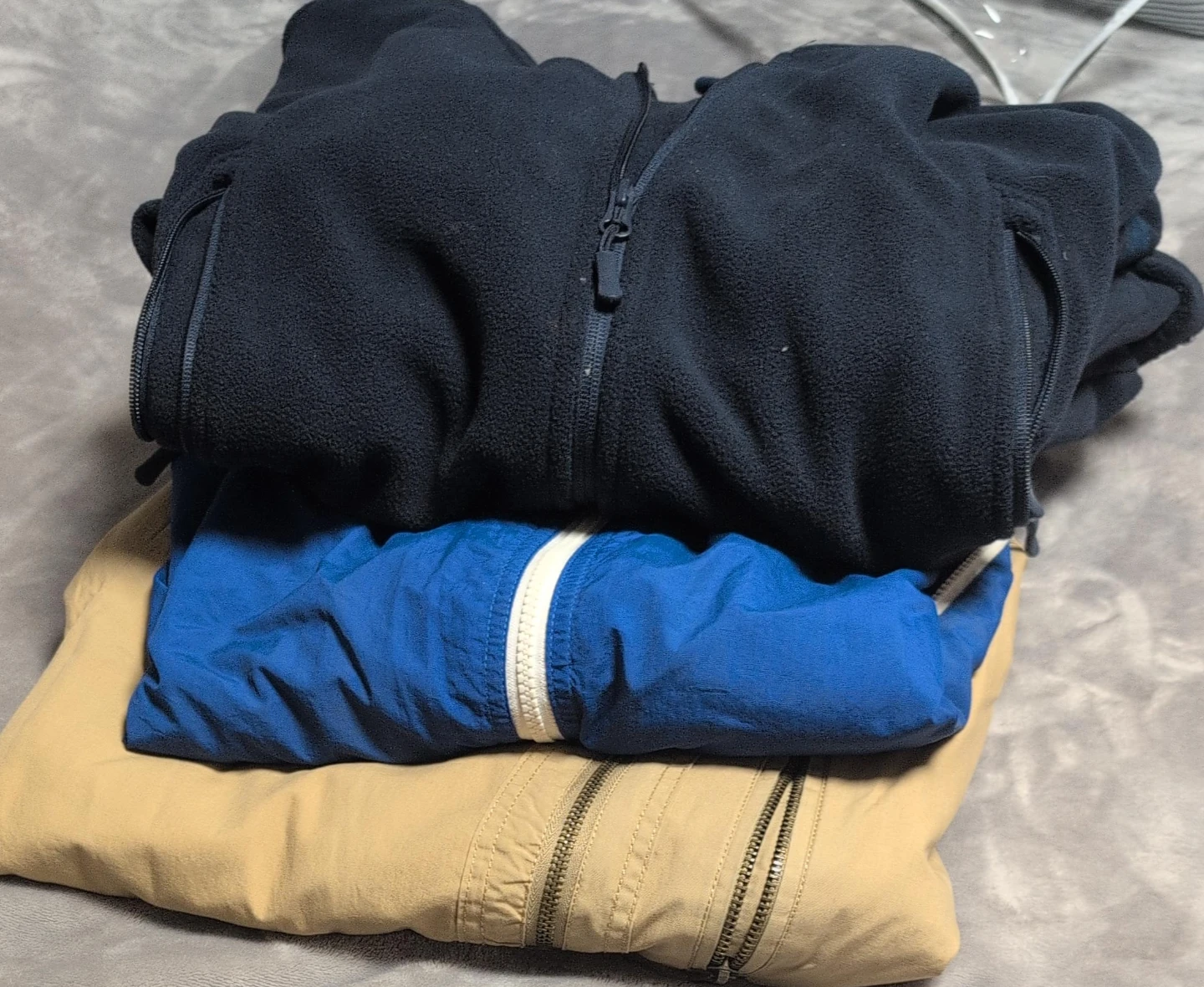 Three assorted zip-up jackets $9 each