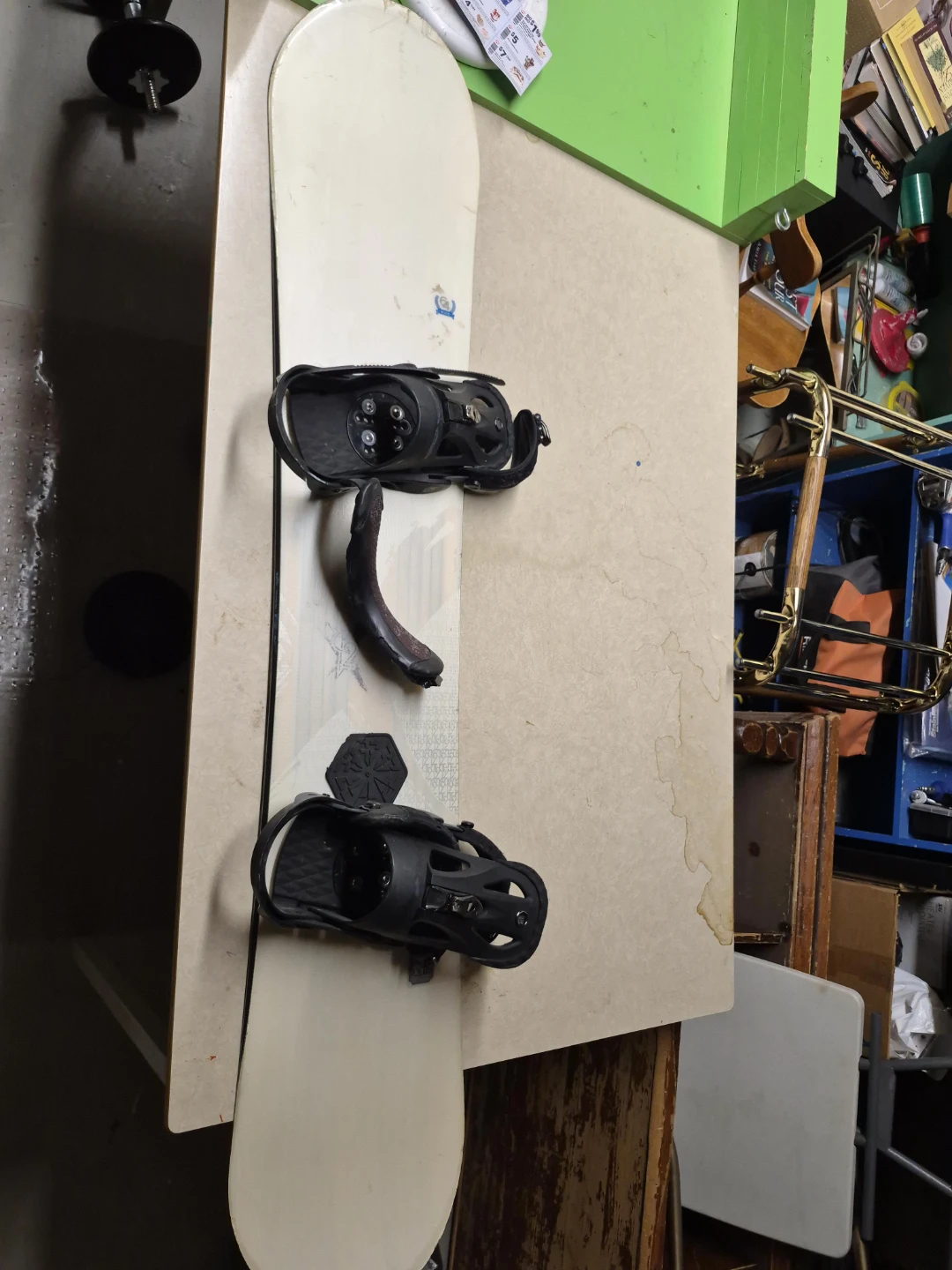 White Snowboard with Black Bindings