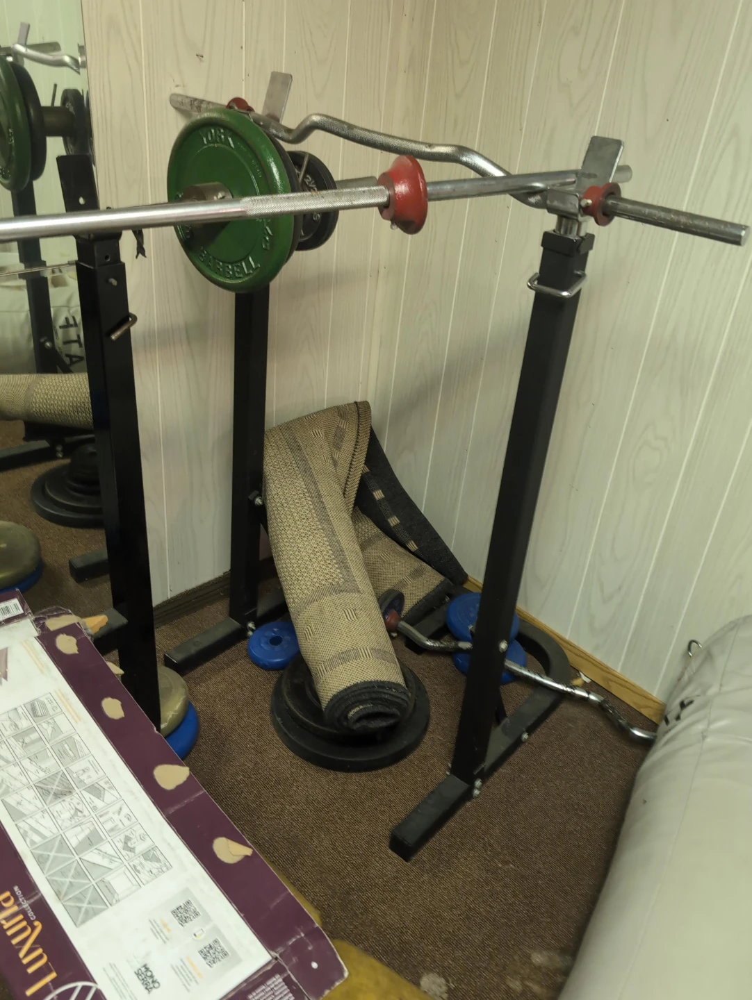 York Barbell squat rack with curl bar