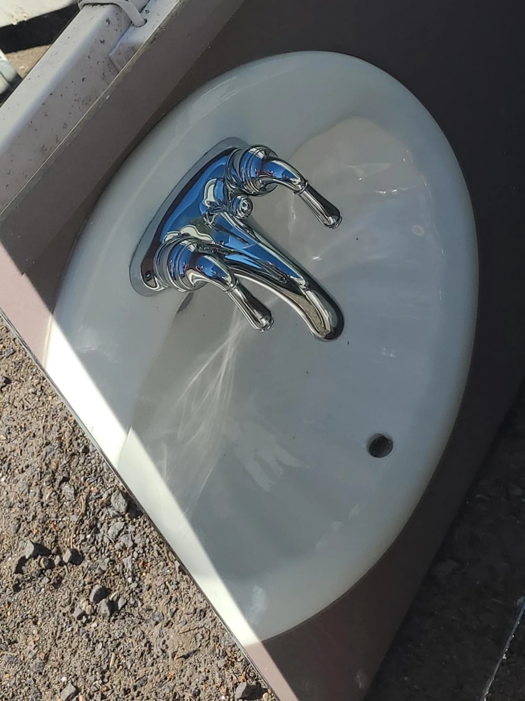 White bathroom sink with chrome faucet