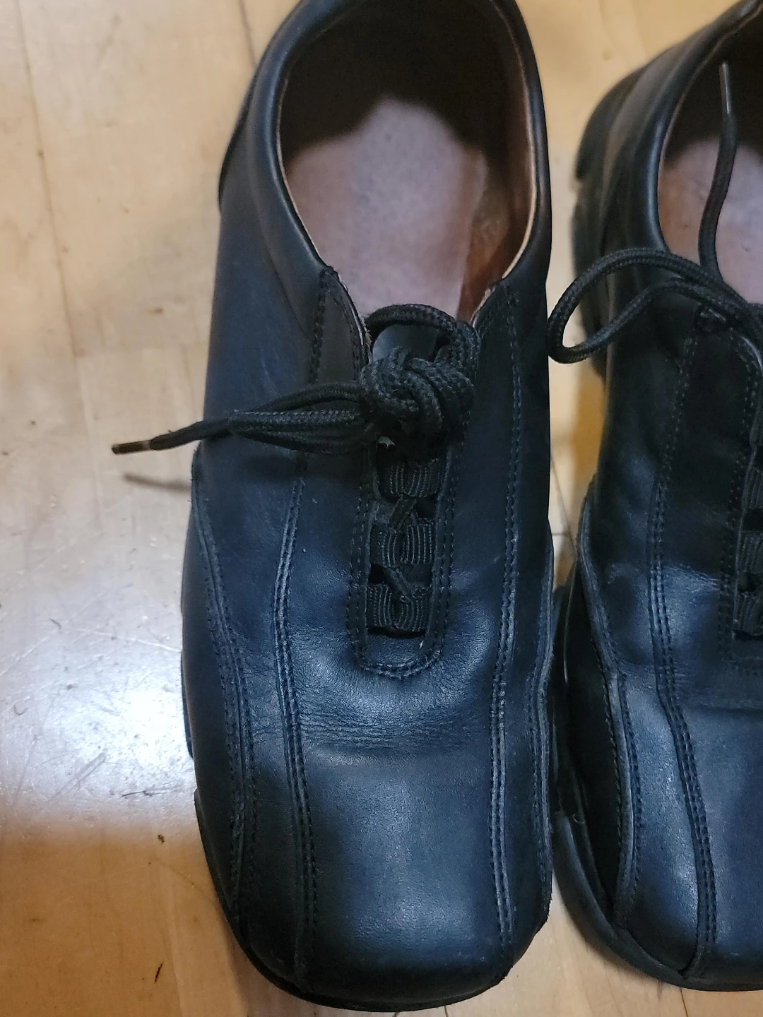 Black leather lace-up shoes