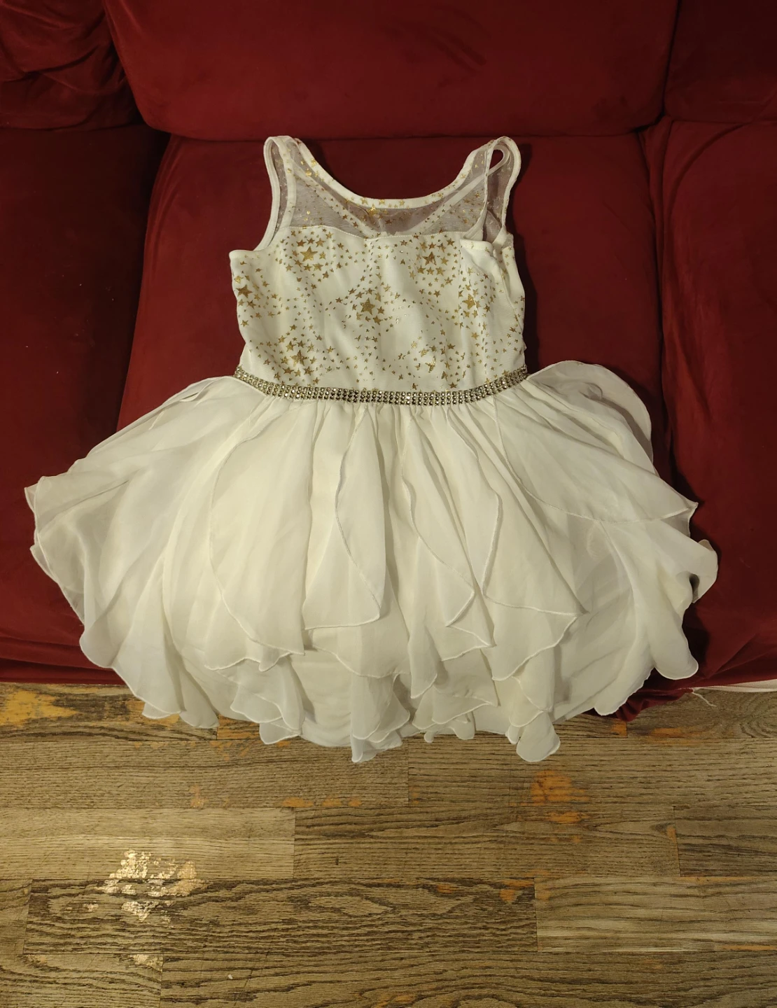 Vestido blanco y dorado con estrellas para niña
