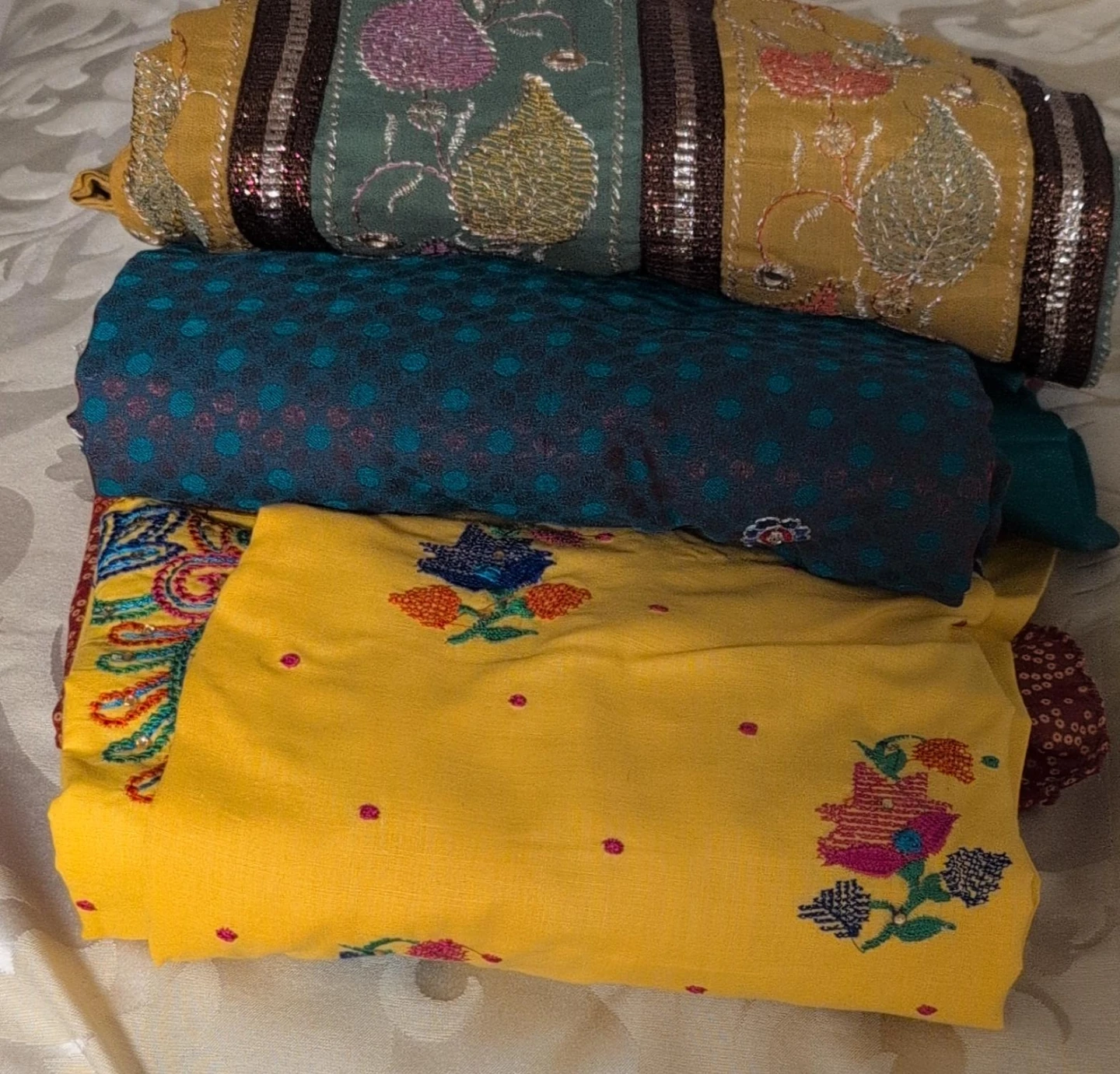 Set of three embroidered ethnic fabrics