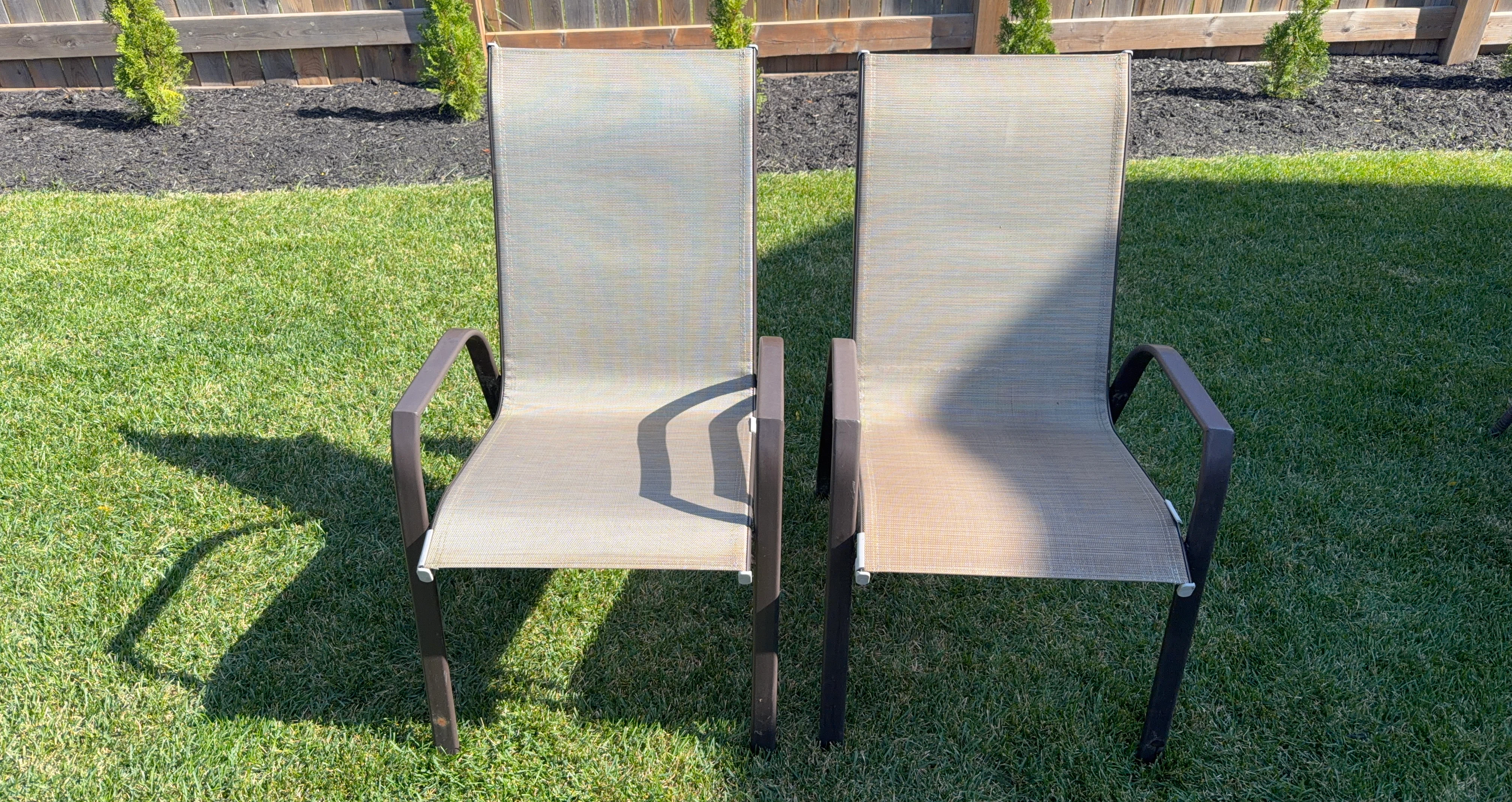 Two outdoor patio chairs