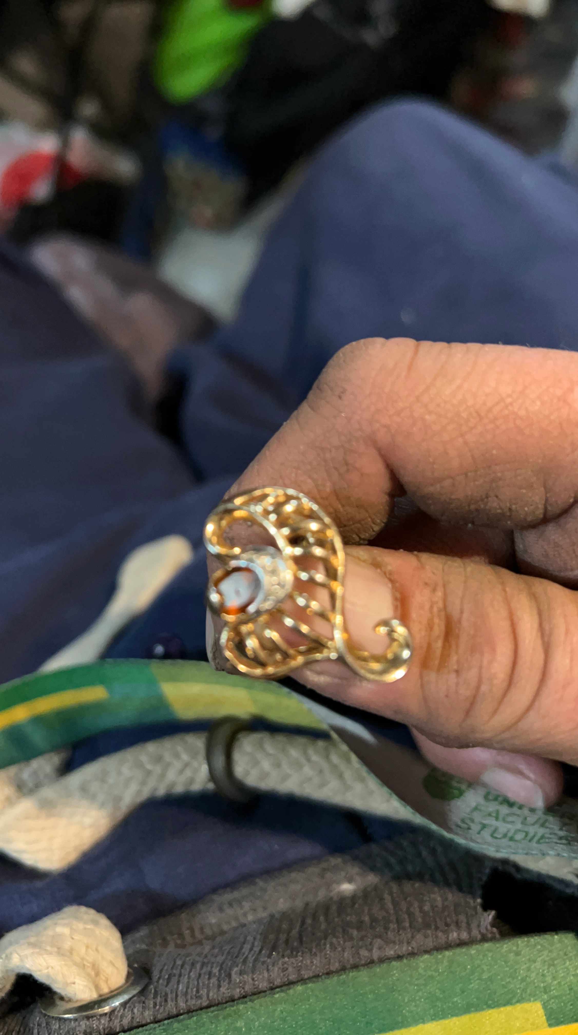Gold-tone filigree ring with stone