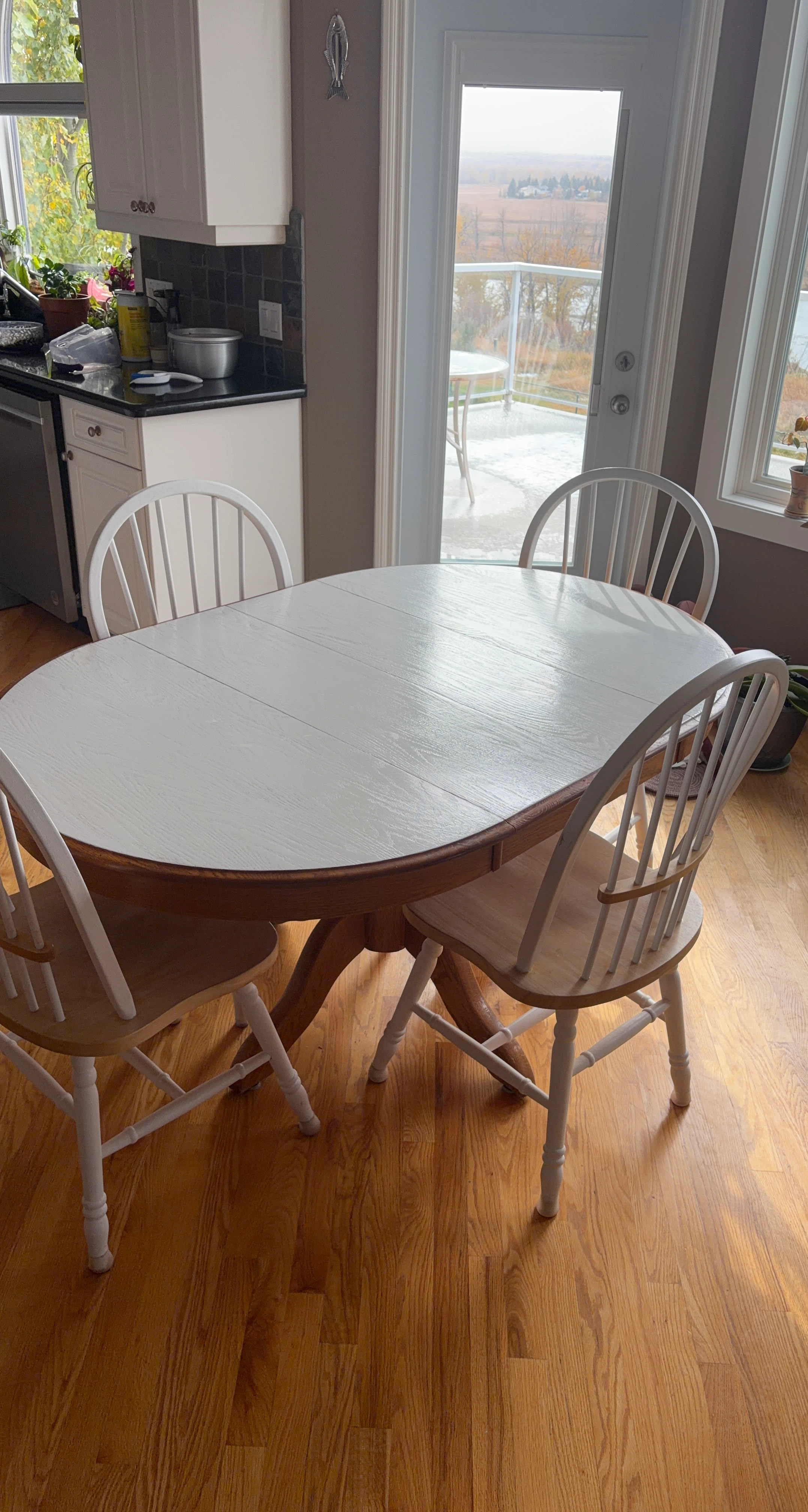 White Oval Dining Table with 4 Chairs