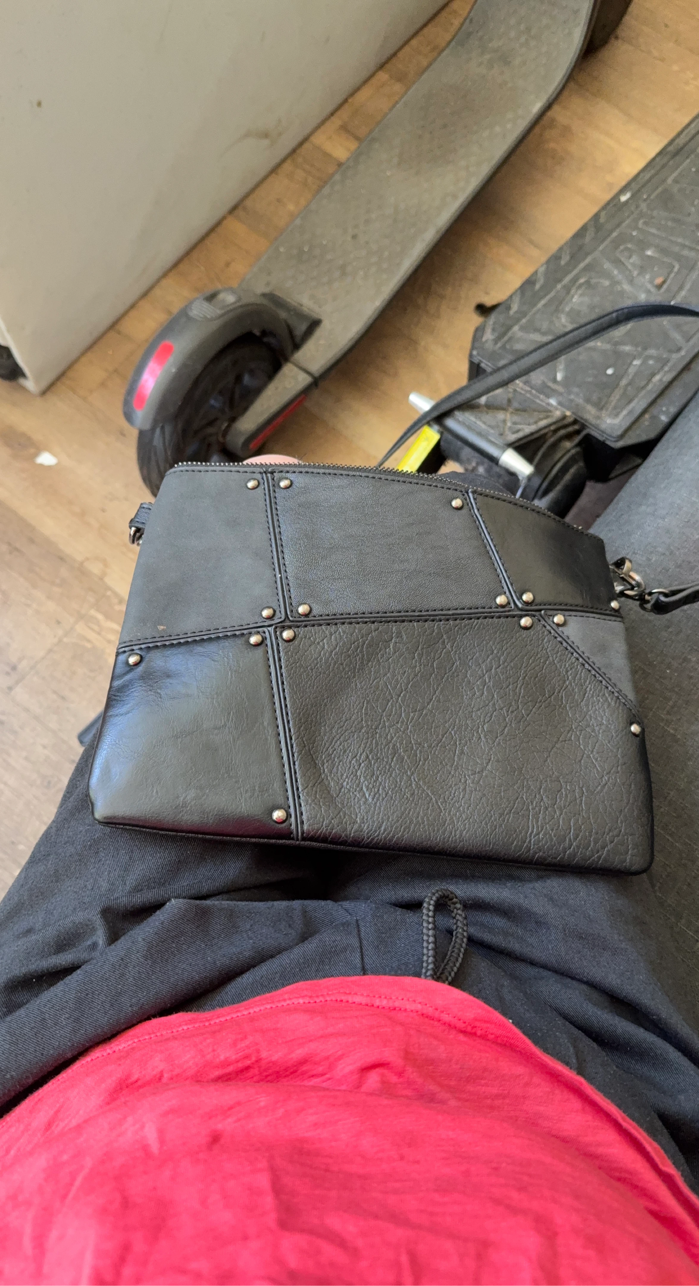 Black leather crossbody bag with studded detail