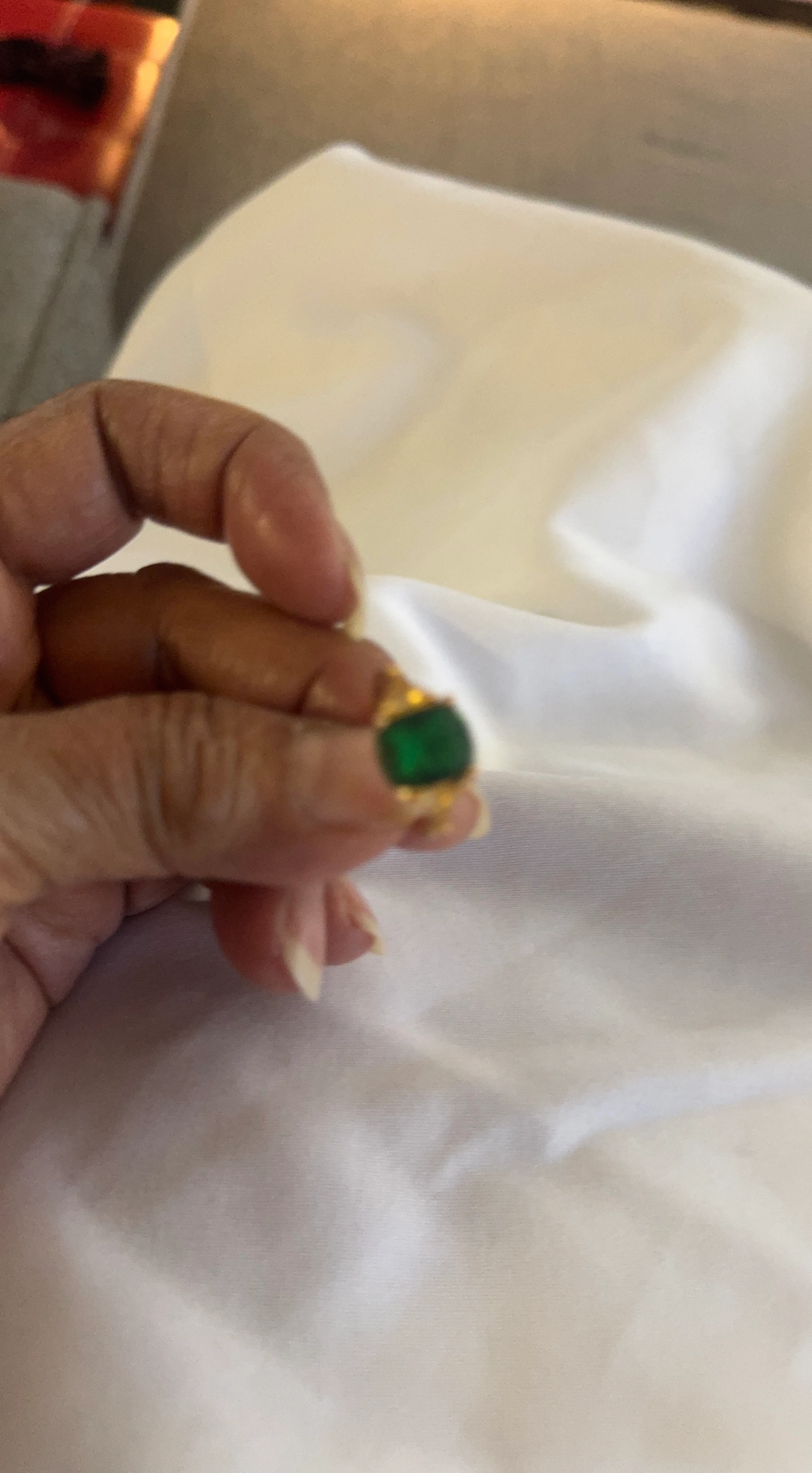 Gold ring with green stone