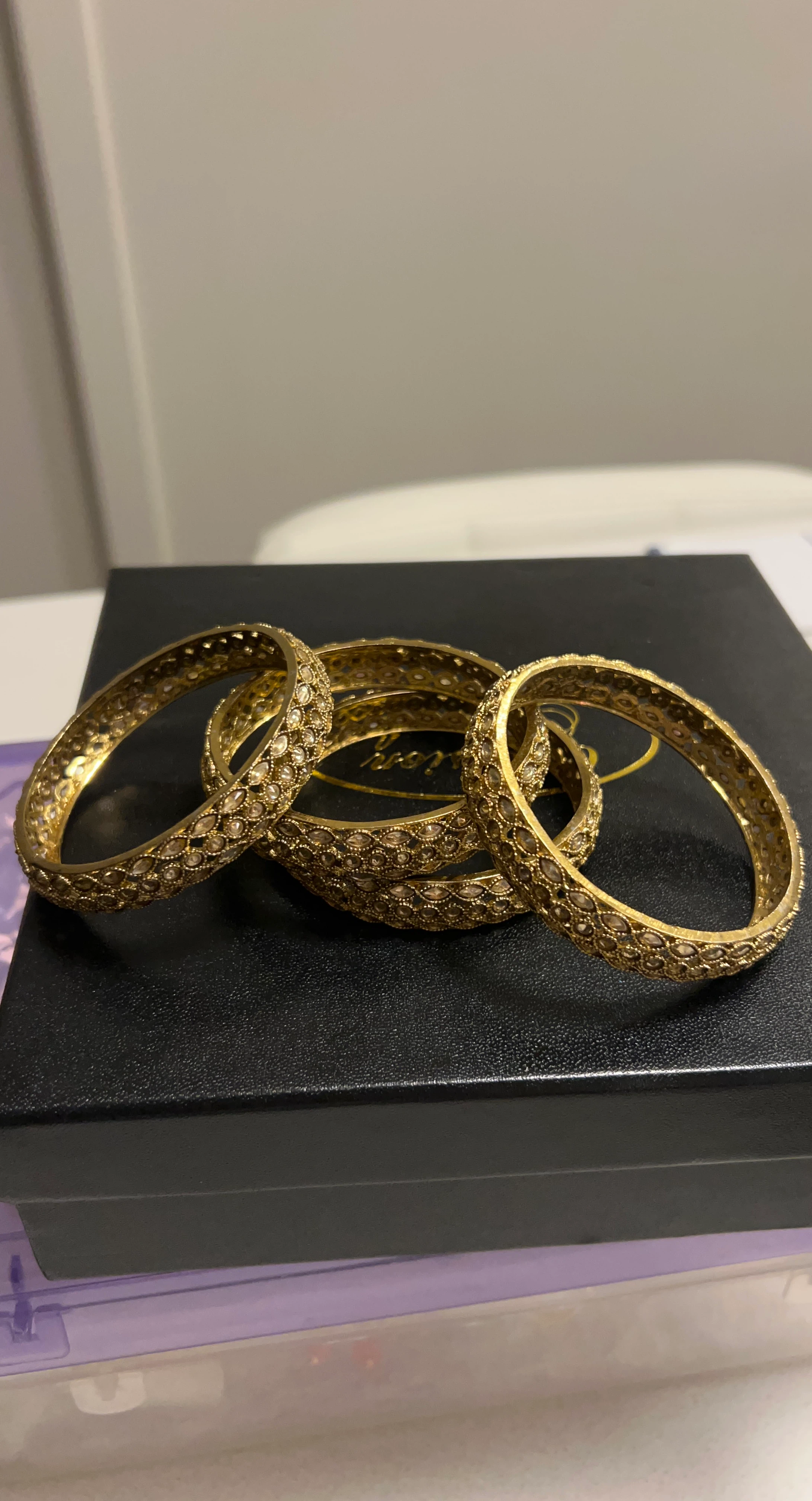 Gold-tone ornate bangle bracelets