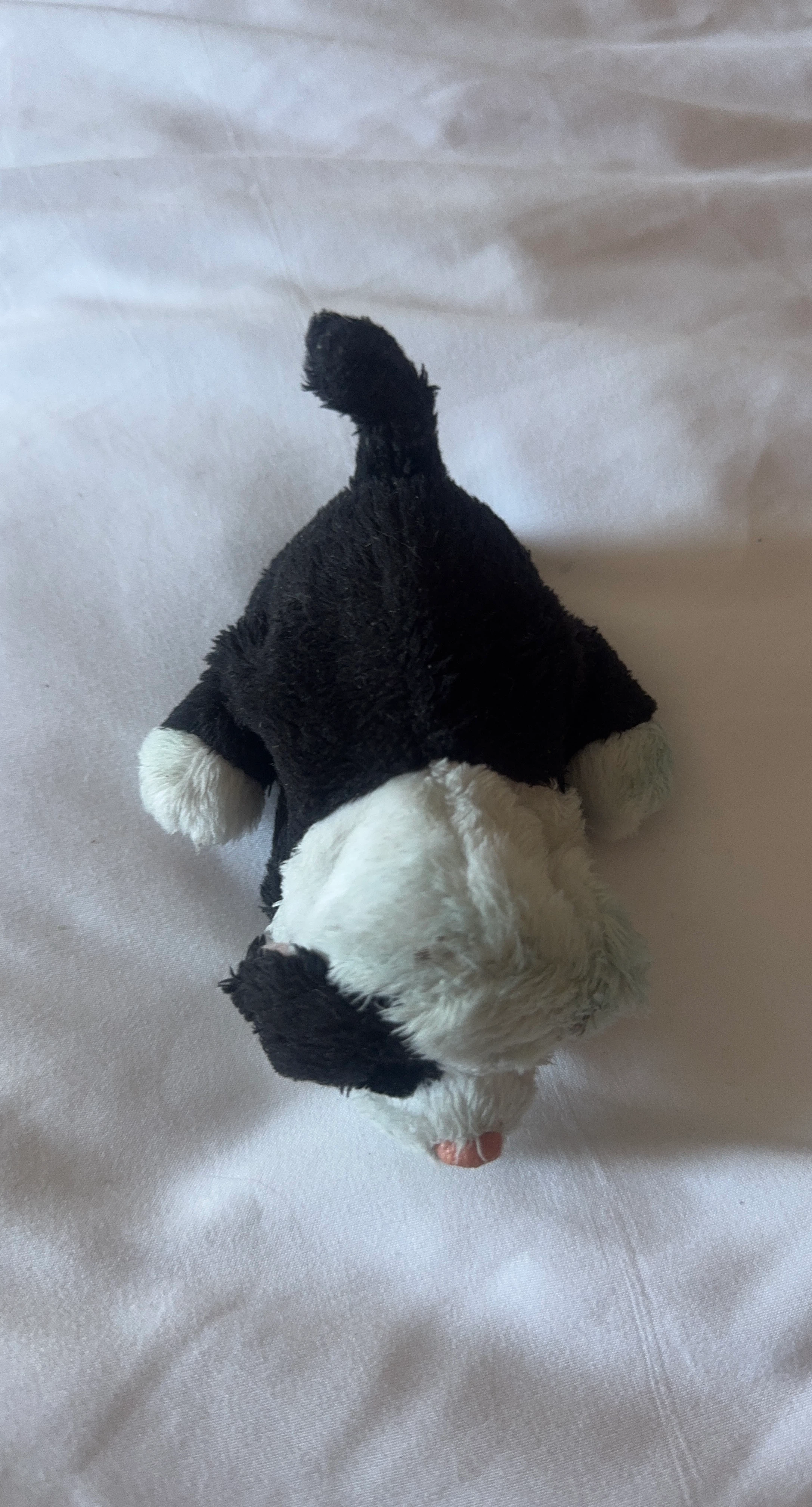 Black and white plush puppy toy