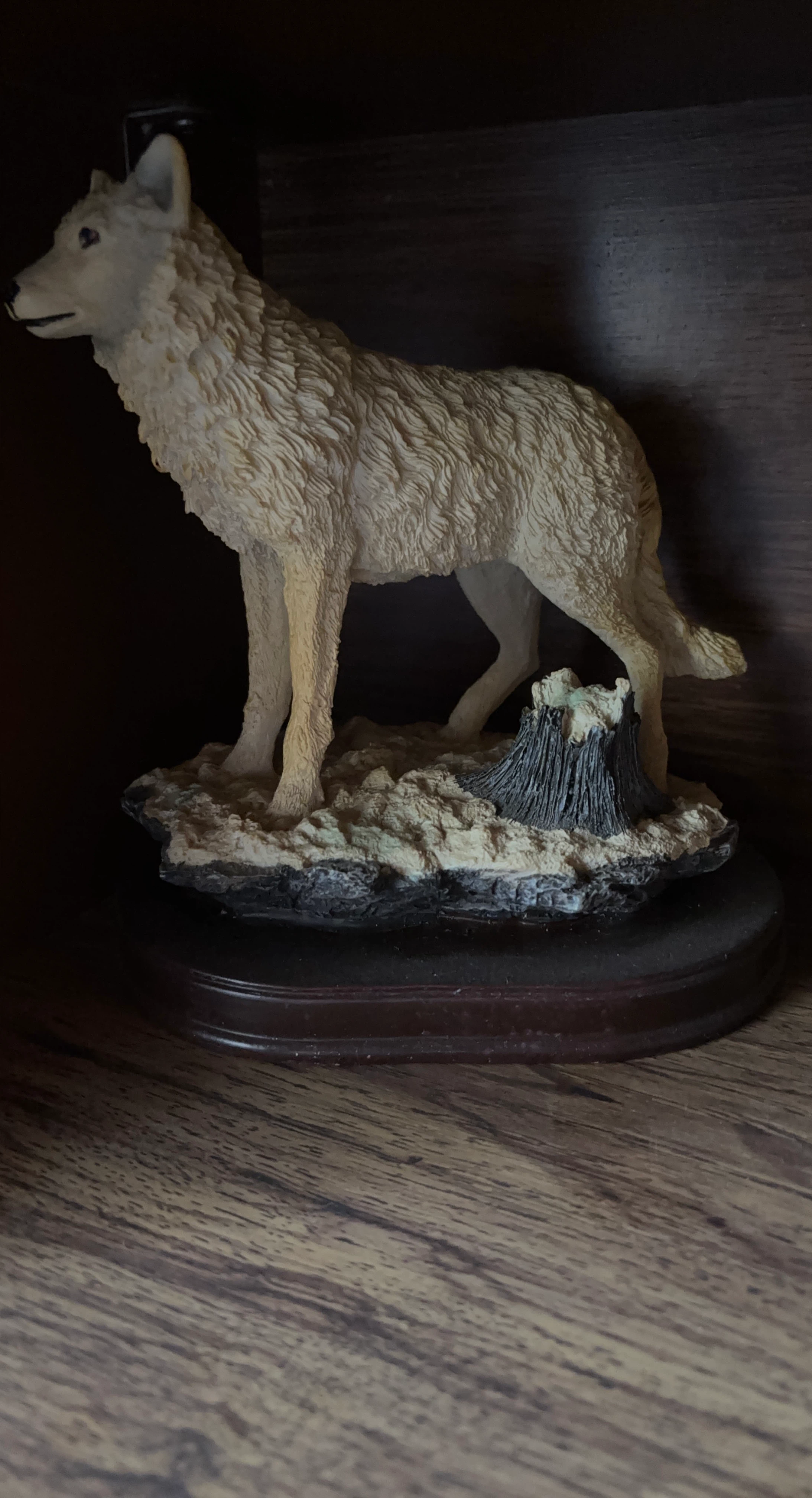 Wolf figurine on wooden base