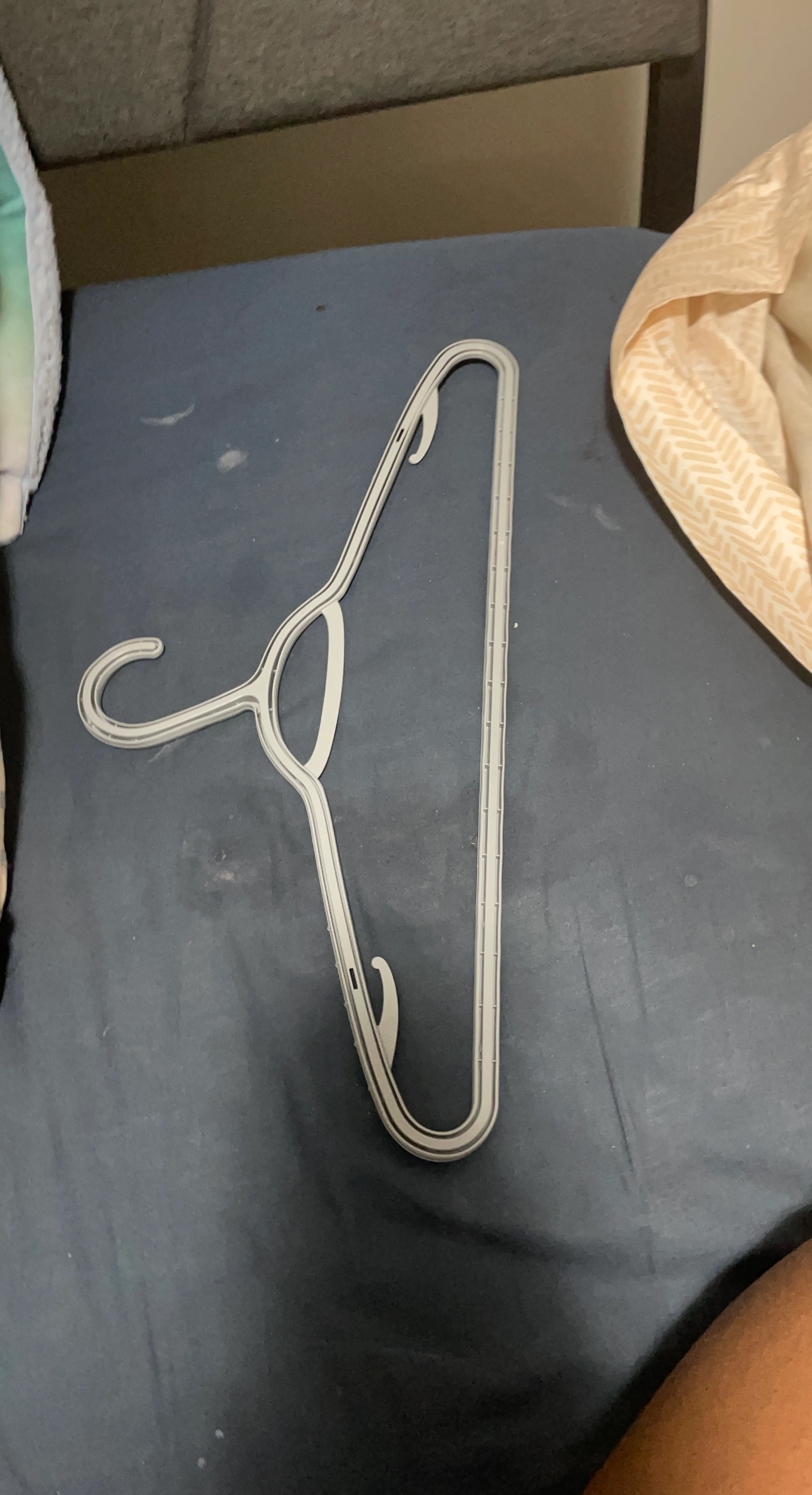 White plastic clothing hanger