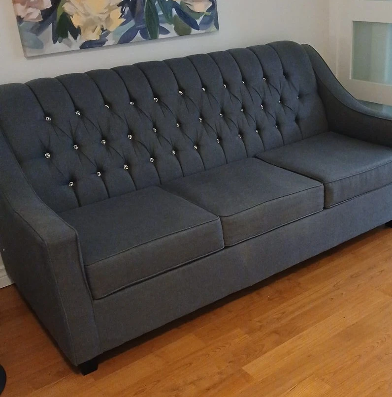 Tufted Grey Three-Seater Sofa