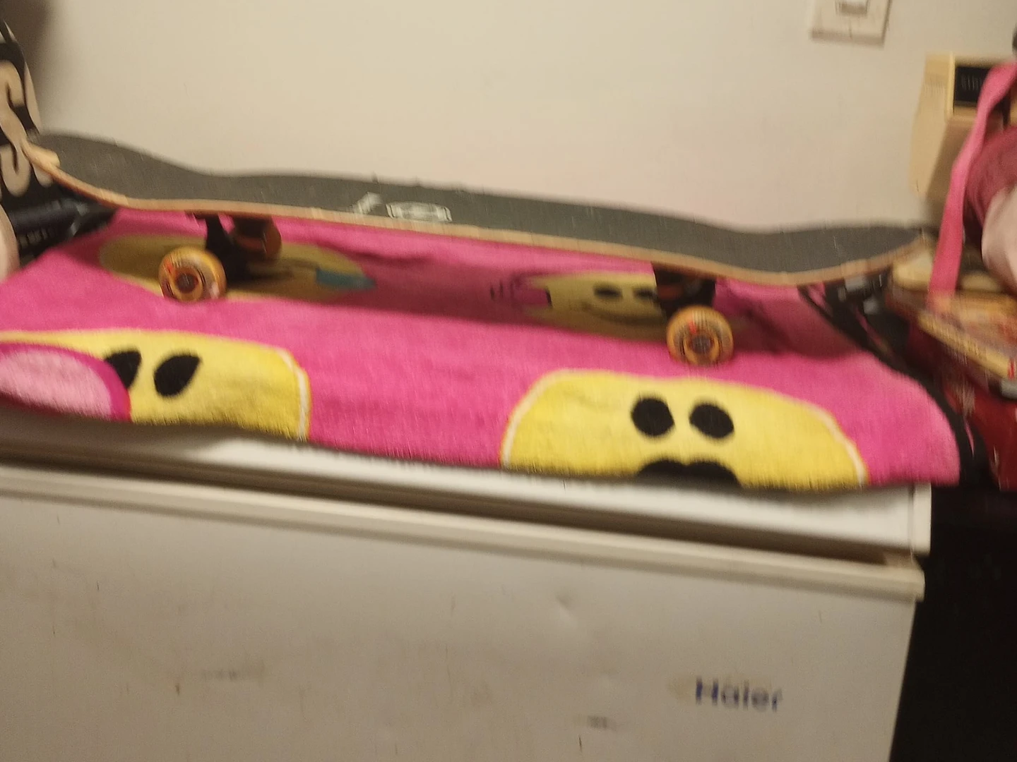 Skateboard with orange wheels