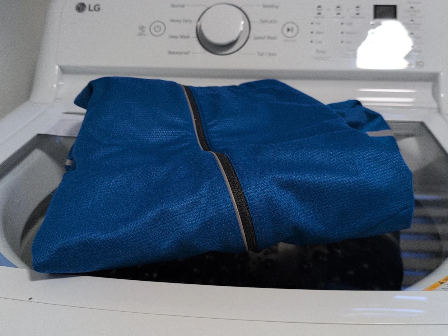 Blue athletic zip-up jacket