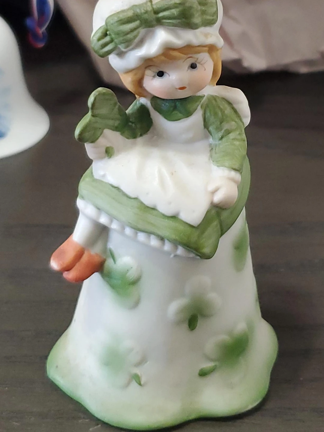 Porcelain Girl Figurine Bell with Clover Motif