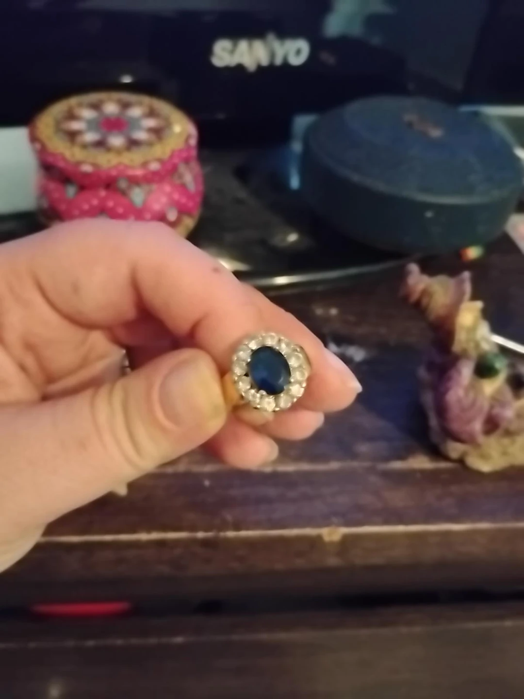 Gold-tone ring with blue centre stone