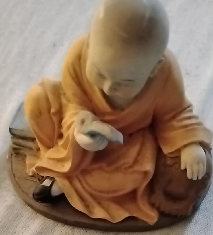 Small Monk Figurine Reading