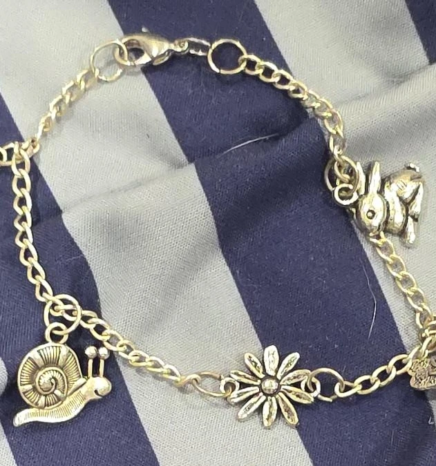 Gold tone charm bracelet