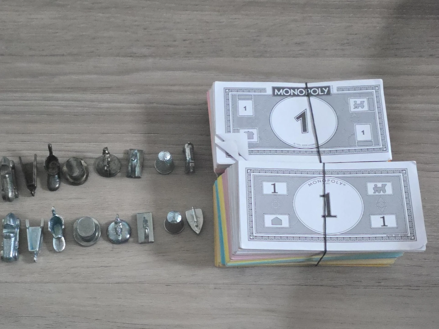 Monopoly game pieces and currency