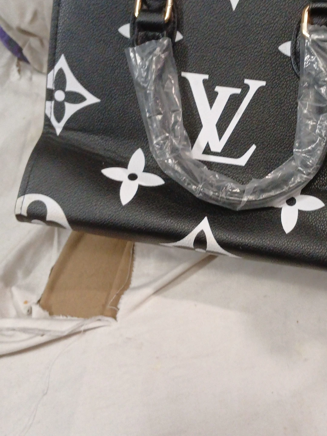 Black and white LV patterned handbag