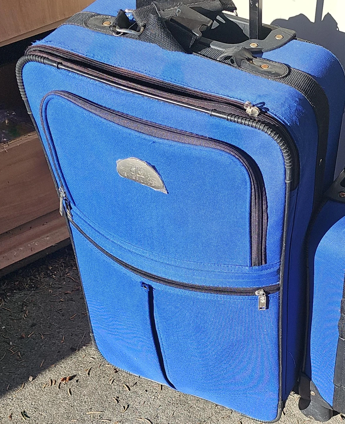 Blue Everlite Rolling Suitcase