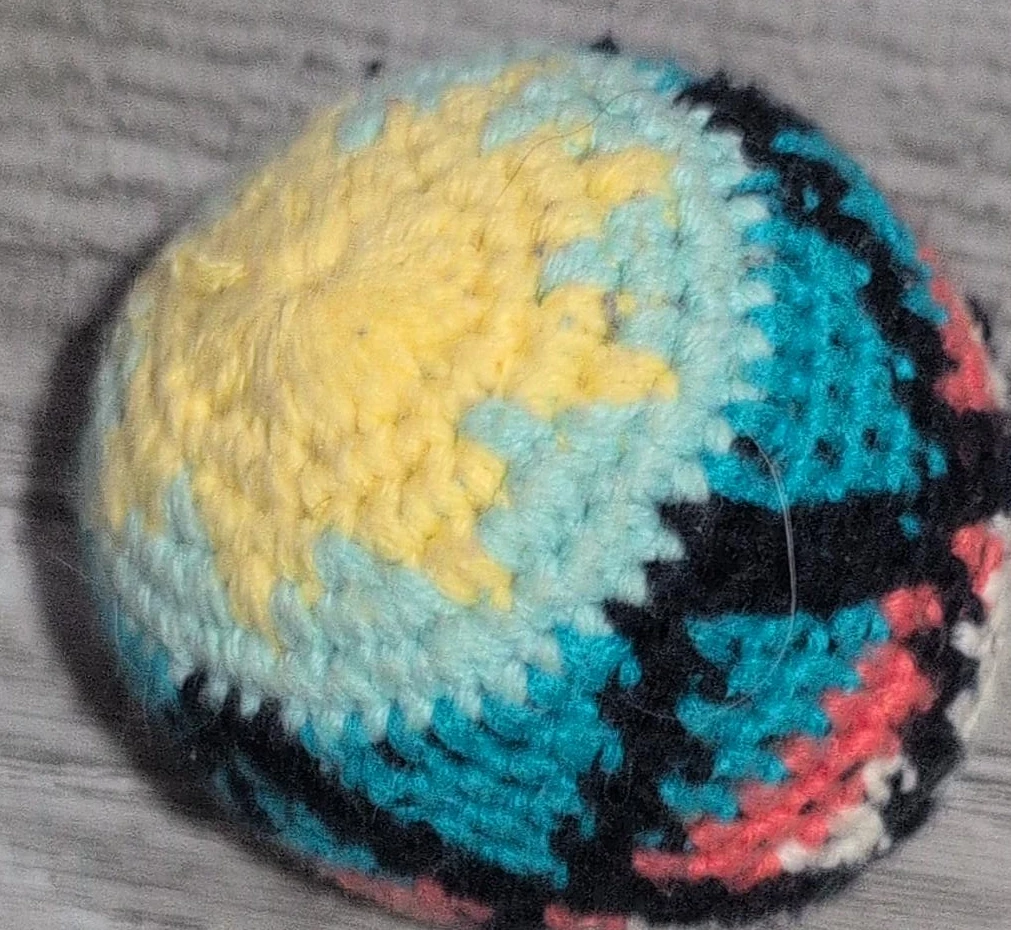 Hand-crocheted yarn ball toy