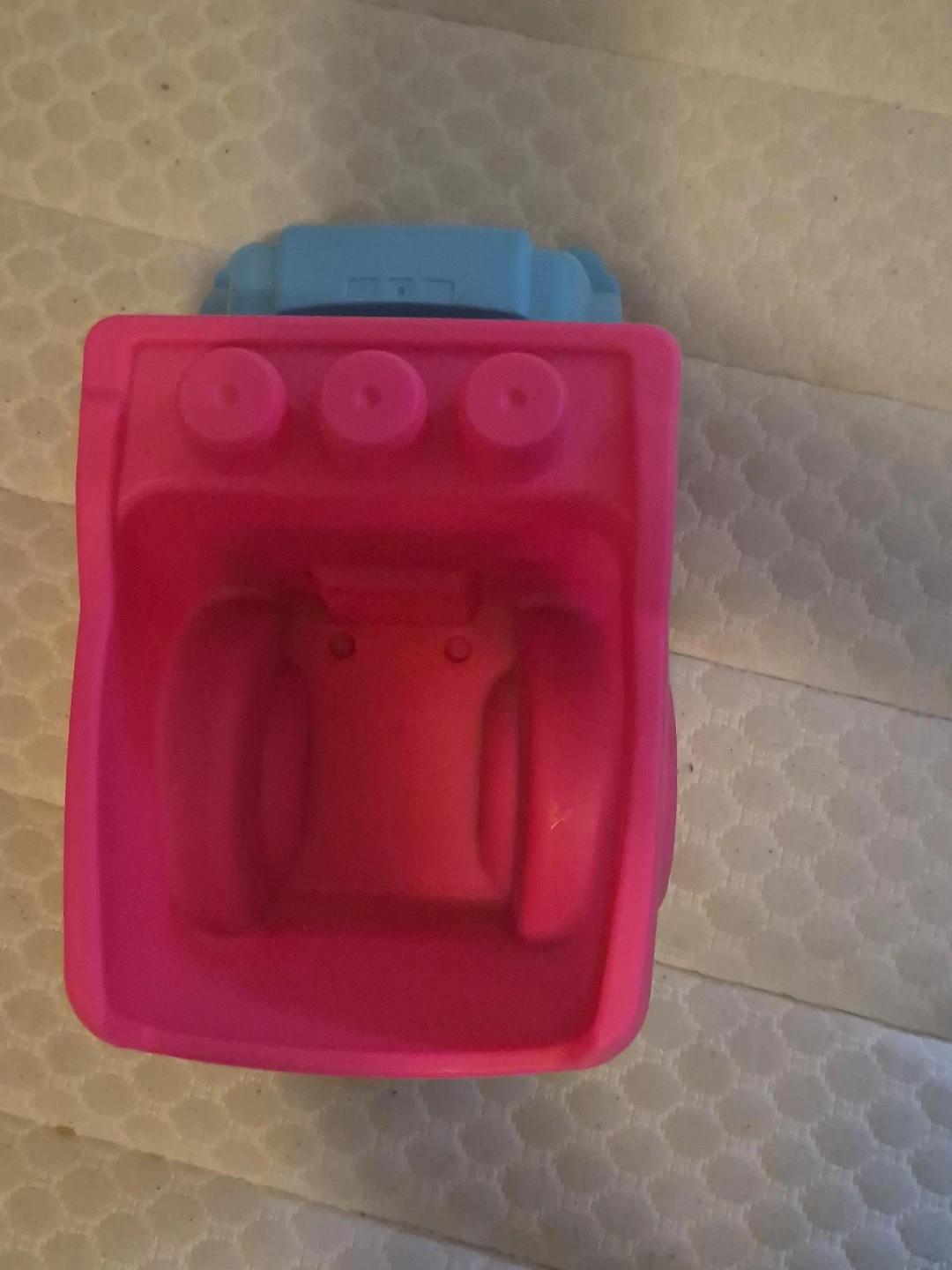 Pink and blue plastic toy dump truck