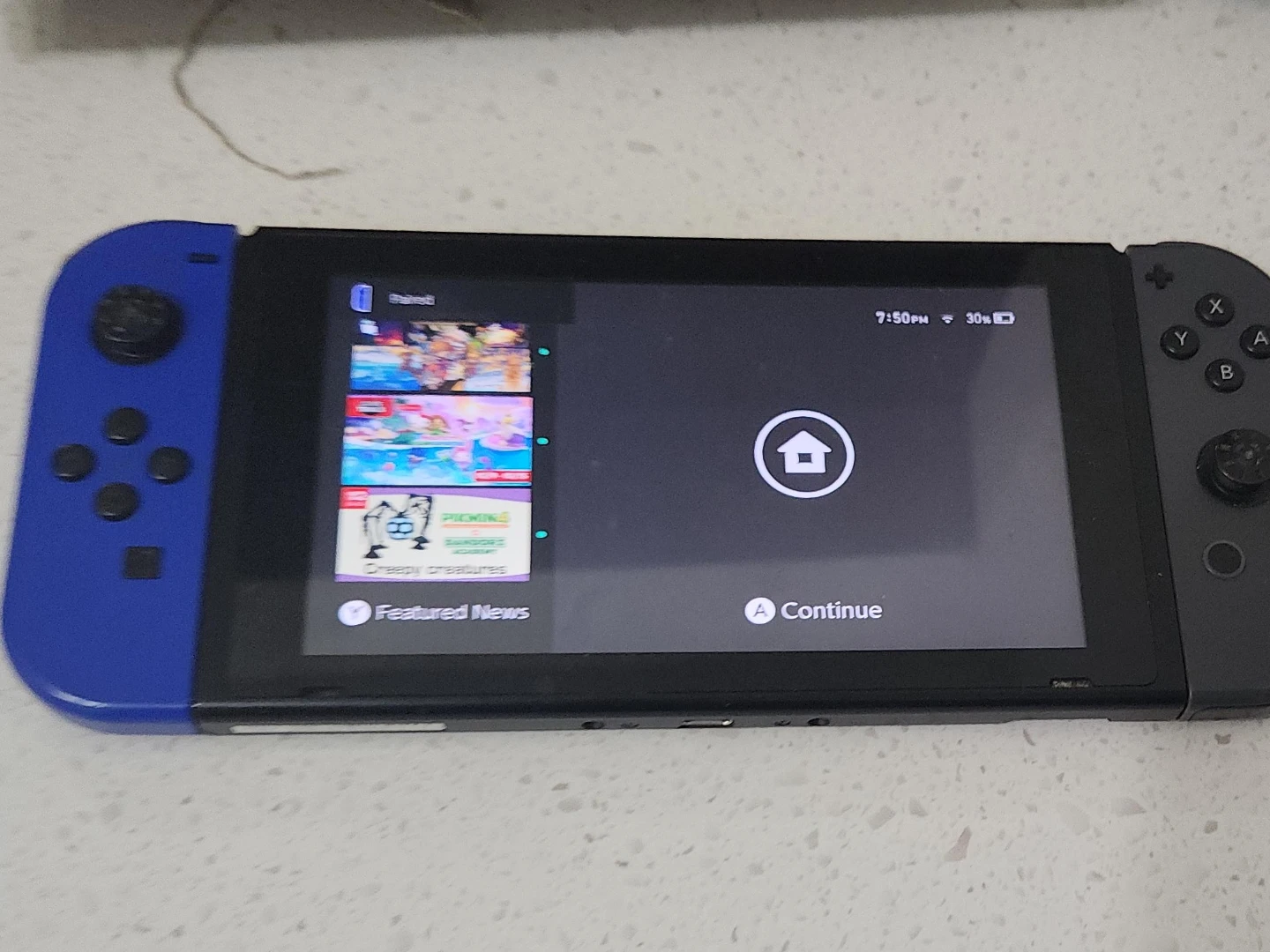 Nintendo Switch Console with Blue and Grey Joy-Cons