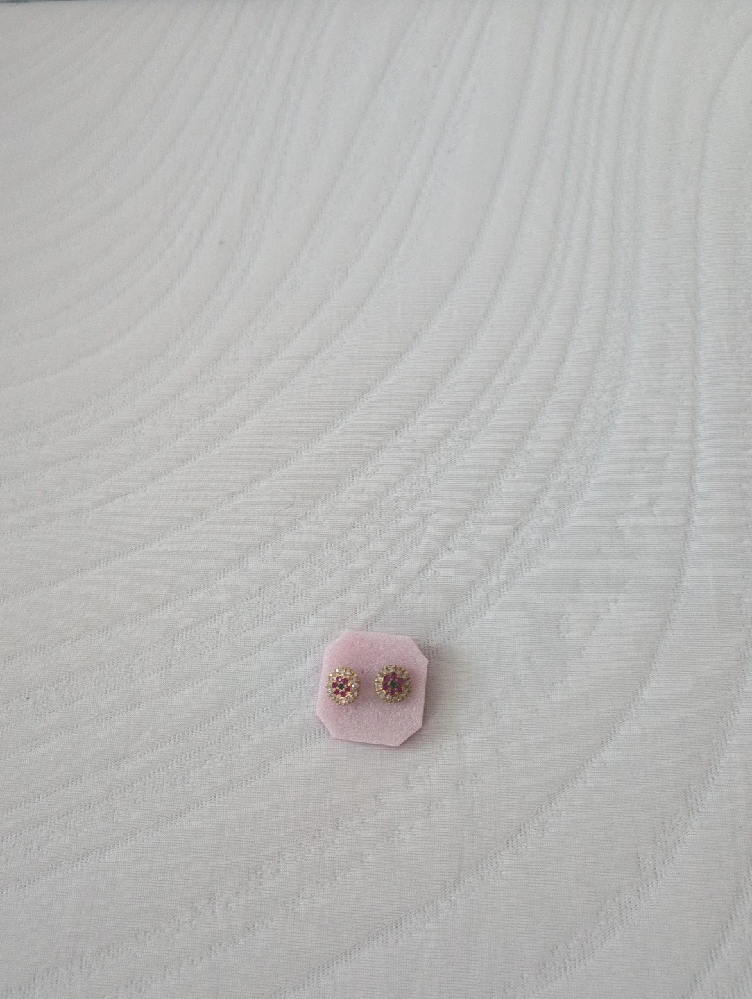 Gold stud earrings with red and white stones